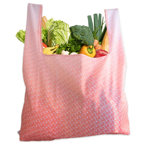 Kokoon taittuva tilava kauppakassi, raikkaalla puna-valkoisella kuviolla.