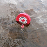 Kelluva avaimenperä logolla