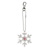 Hiutaleen muotoinen heijastin Punaisen Ristin logolla